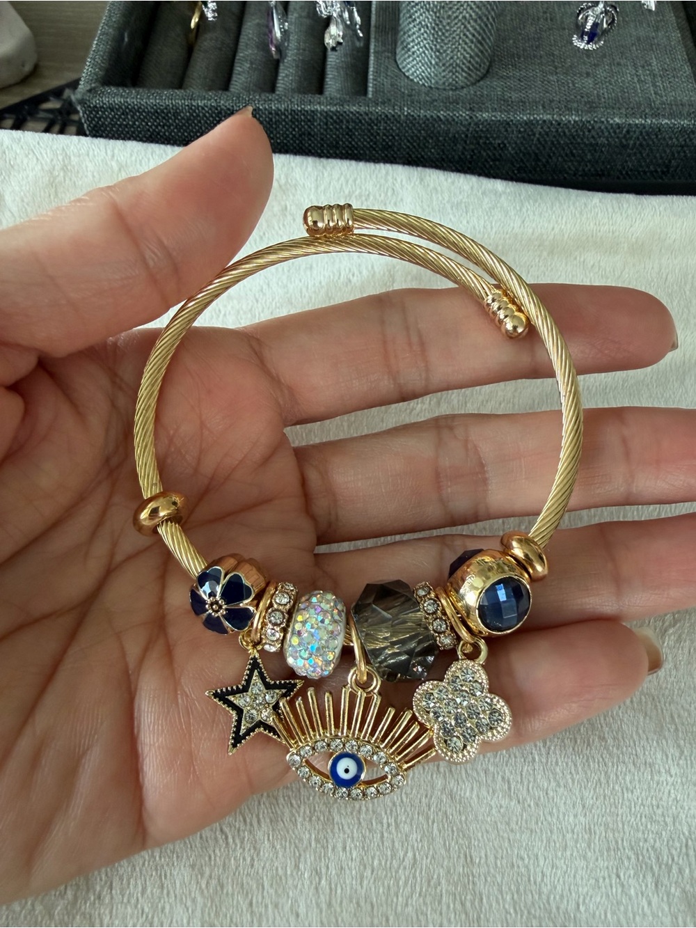 Gold Tone Charm Bracelet with Blue and Crystal Accents